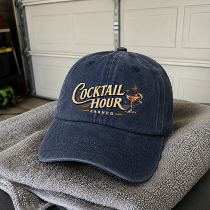 Navy vintage washed cap with printed Cocktail Hour Earned slogan front view