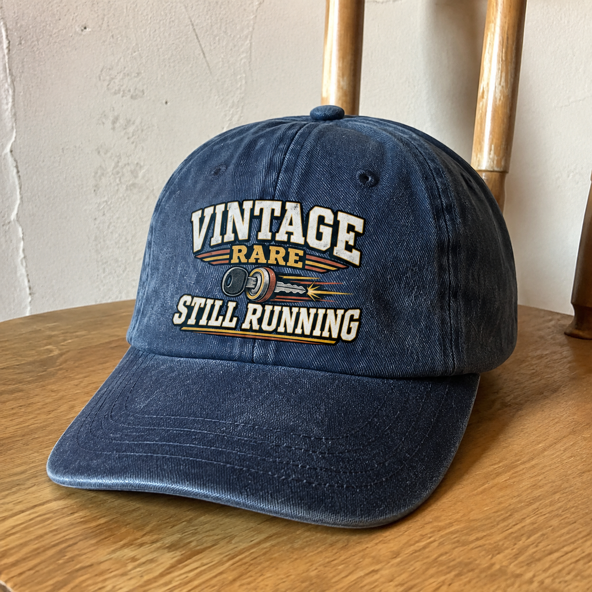 Navy vintage washed cap featuring printed “Vintage Rare Still Running” design, front hero view.