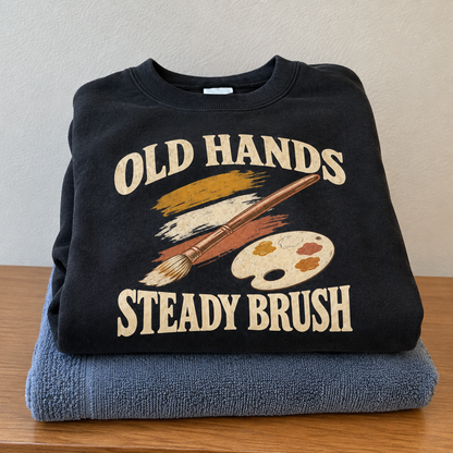 Black vintage sweatshirt with printed Old Hands Steady Brush paint, brush and palette design