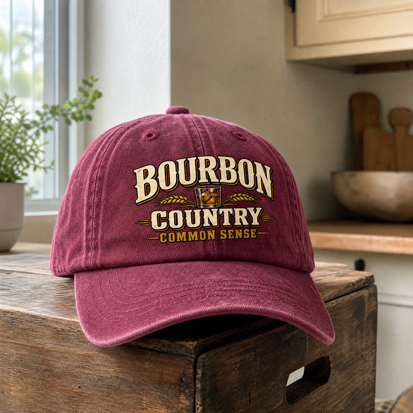 Burgundy vintage washed cap printed with “Bourbon Country Common Sense” on front