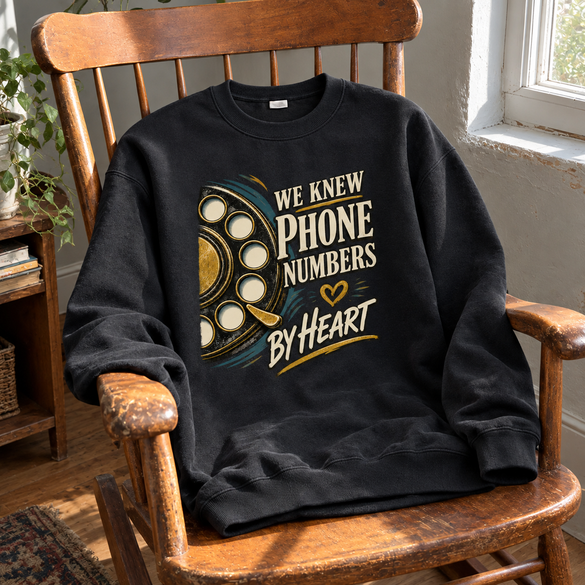 Black vintage sweatshirt with printed “We Knew Phone Numbers By Heart” design, front hero view