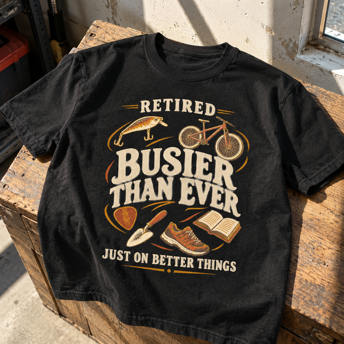 Black vintage t-shirt with printed retired slogan and outdoor hobby illustrations, hero view.