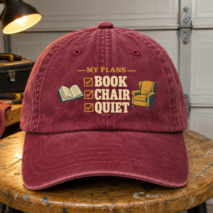 Burgundy vintage washed cap with printed My Plans Book Chair Quiet design, front hero view