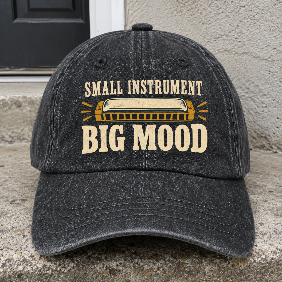 Black vintage washed cap with printed Small Instrument. Big Mood slogan and harmonica design, front view