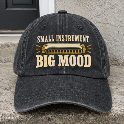 Black vintage washed cap with printed Small Instrument. Big Mood slogan and harmonica design, front view