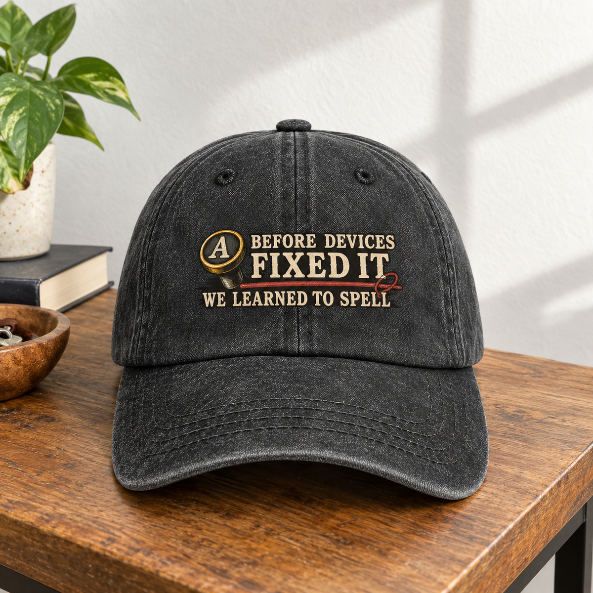 Black vintage washed cap with printed “Before Devices Fixed It” slogan, front hero view