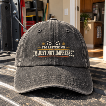 Charcoal vintage washed cap with printed I'm Listening I'm Just Not Impressed slogan