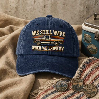 vintage washed cap product shot with We Still Wave When We Drive By printed design