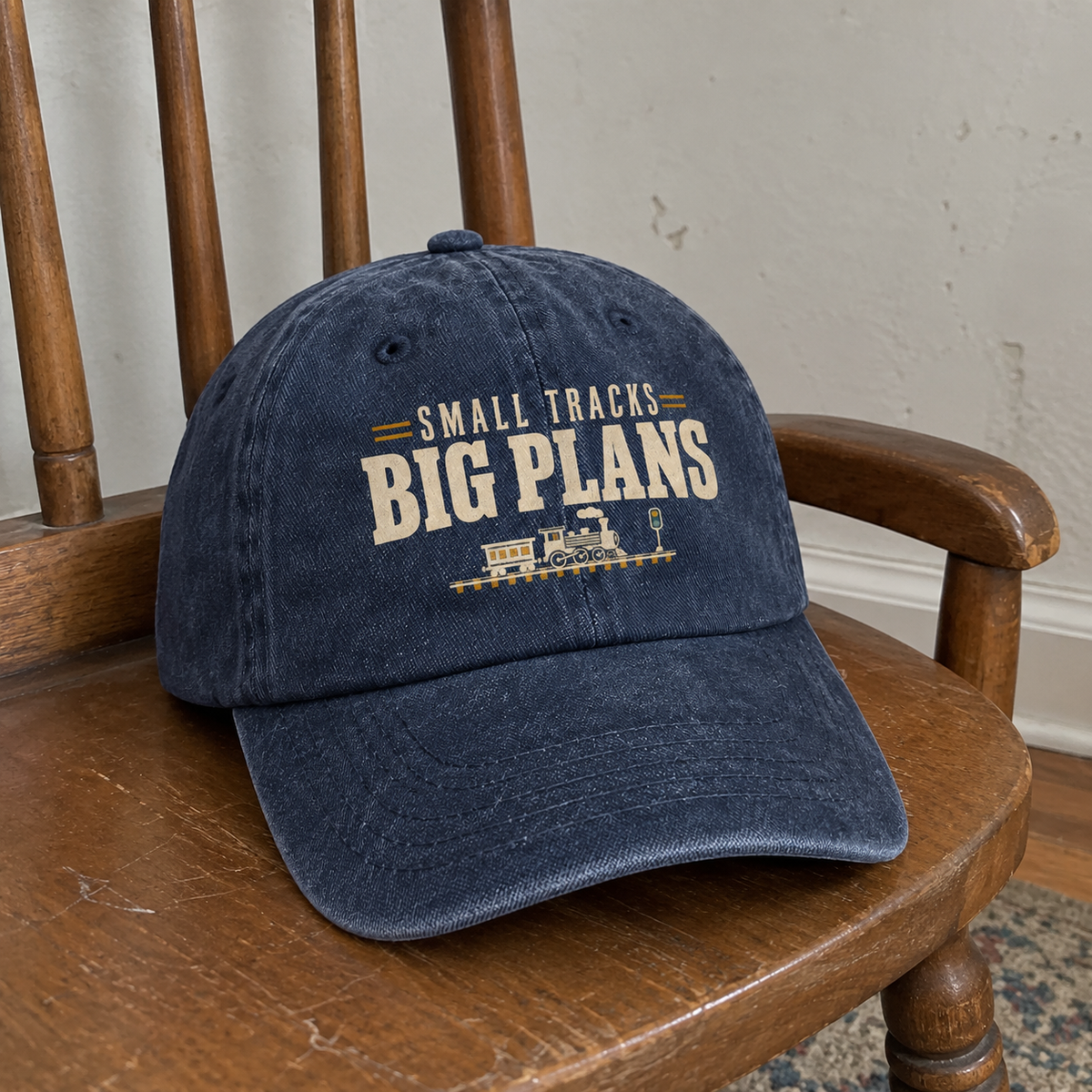 Vintage washed cap in dark blue with Small Tracks Big Plans printed design