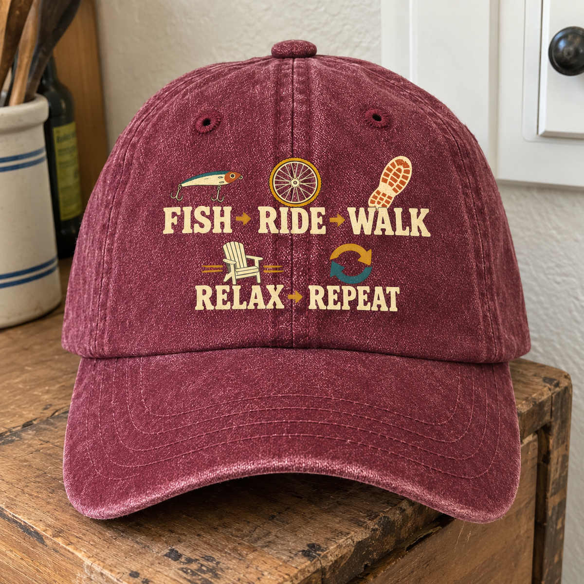 Burgundy vintage washed cap with printed Fish Ride Walk Relax Repeat design, front view