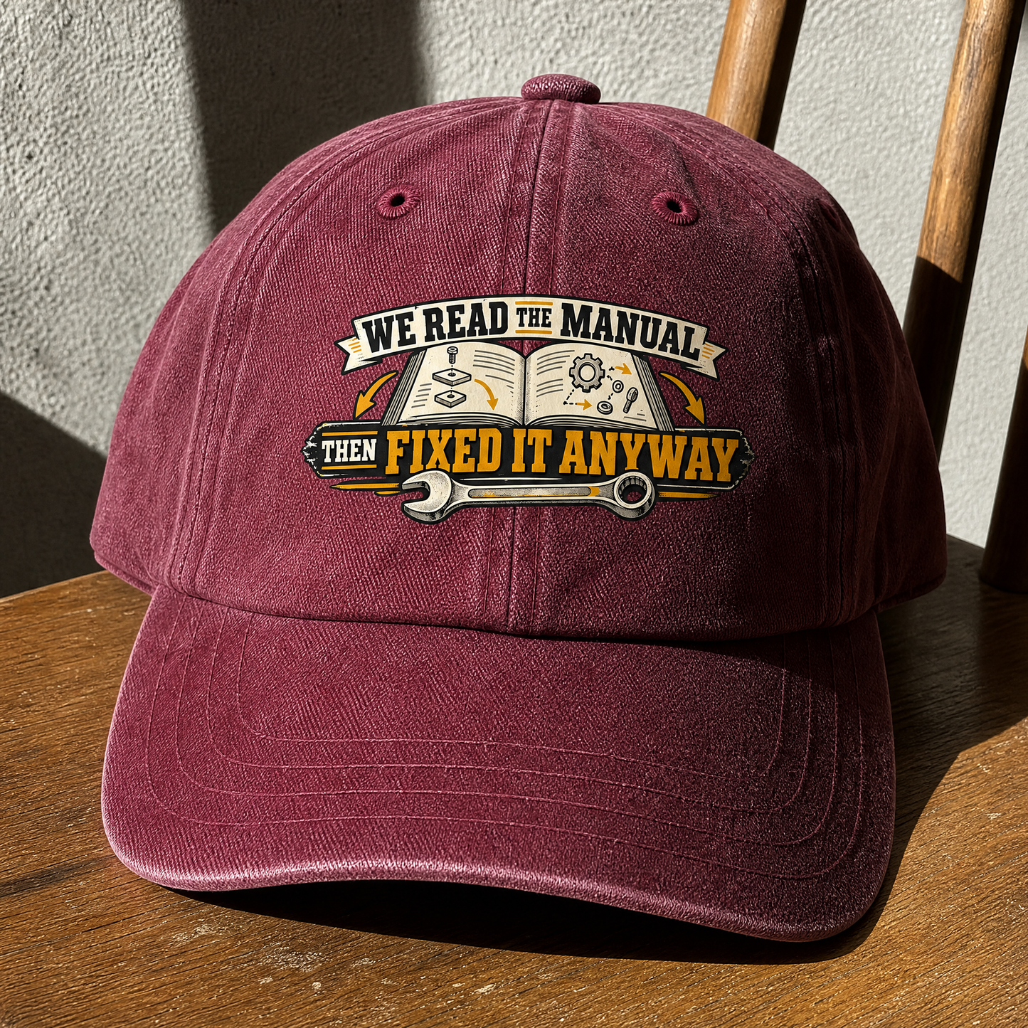 Burgundy vintage washed cap featuring printed We Read The Manual Then Fixed It Anyway design