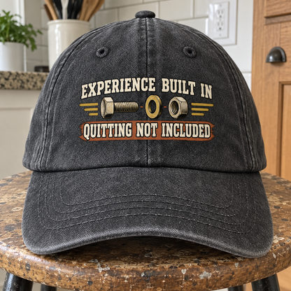 Black vintage washed cap, front view, printed Experience Built In Quitting Not Included.