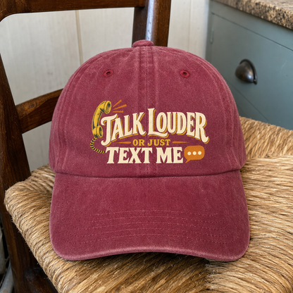 Burgundy vintage washed cap with printed “Talk Louder Or Just Text Me” slogan, front view.