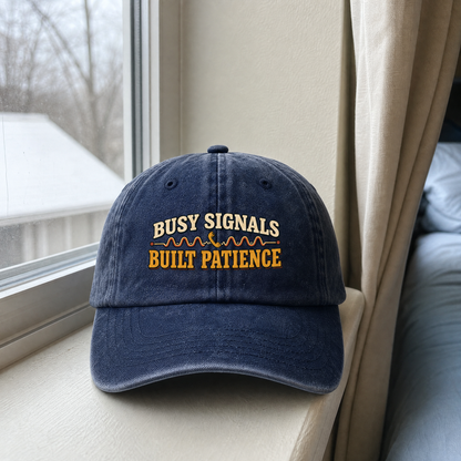 Blue vintage washed cap with printed Busy Signals Built Patience slogan front view