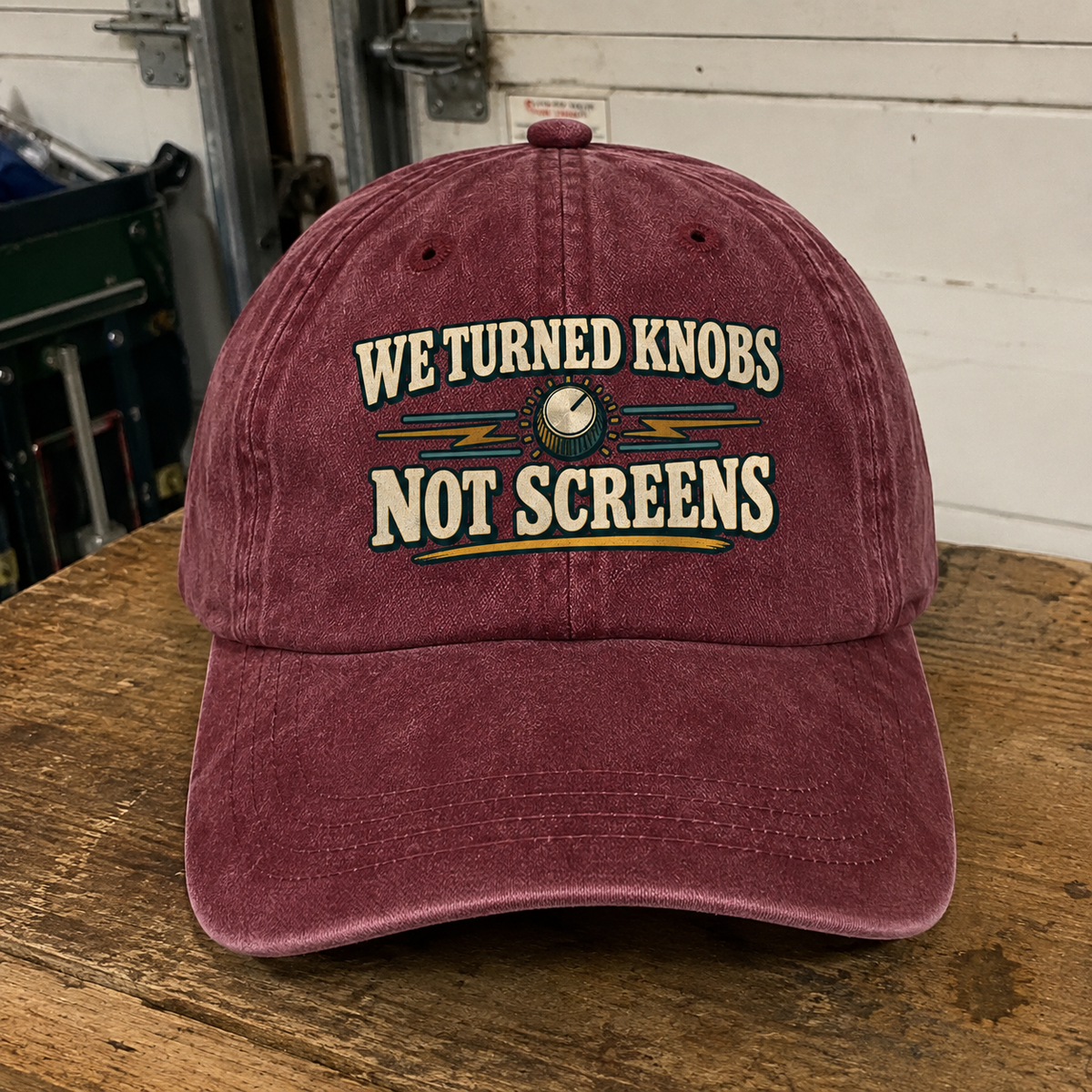 Vintage washed cap with printed We Turned Knobs Not Screens slogan in burgundy front view