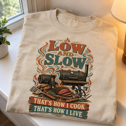 Cream vintage t-shirt with printed Low And Slow barbecue slogan and smoker design, front view