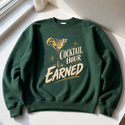 Dark green vintage sweatshirt with printed Cocktail Hour Earned cocktail glass design, hero view.