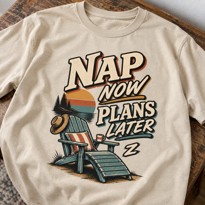 Cream vintage t-shirt on wooden table with printed Nap Now Plans Later and lakeside chair