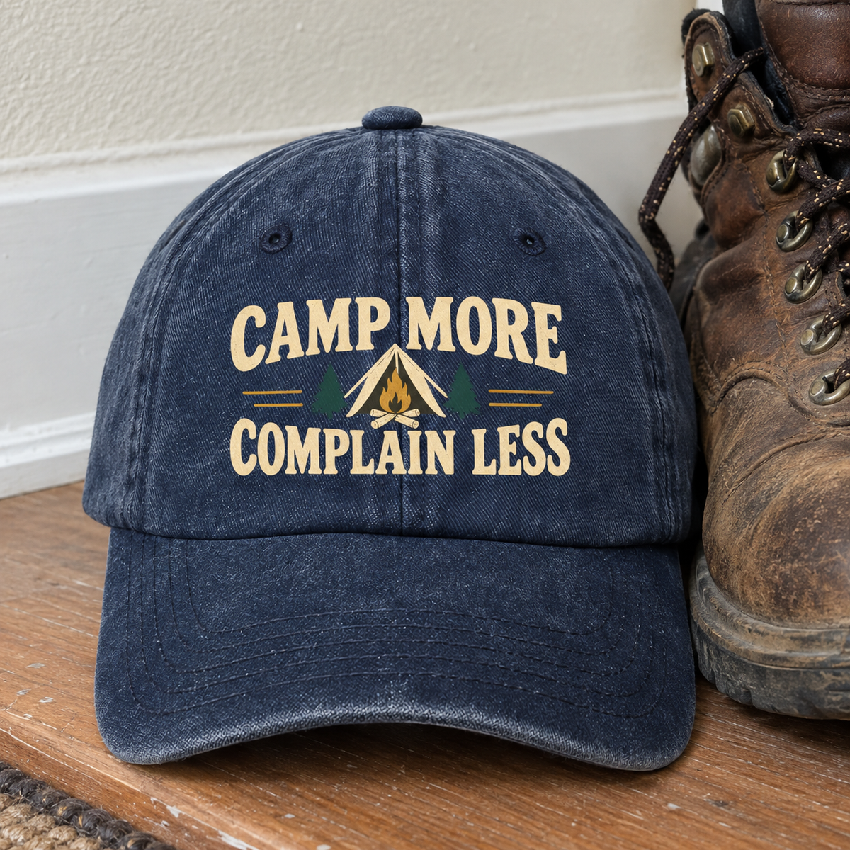 Vintage washed cap in navy with printed Camp More. Complain Less camping design, front view
