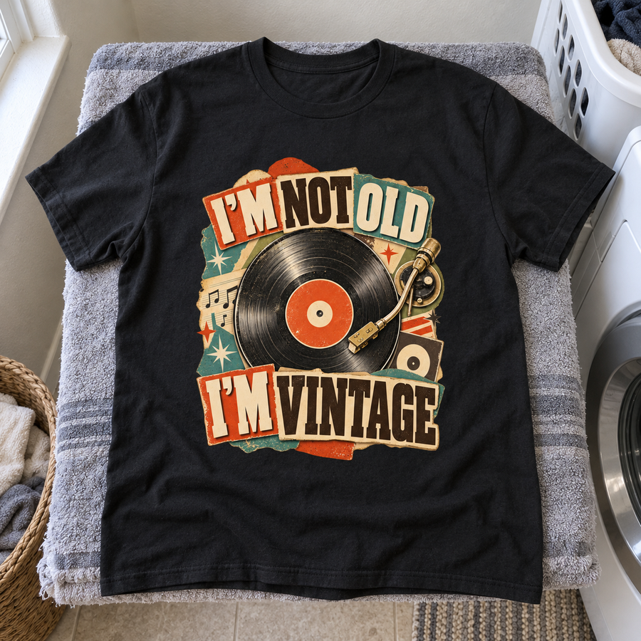 Black vintage t-shirt with printed “I’m Not Old, I’m Vintage” vinyl record design