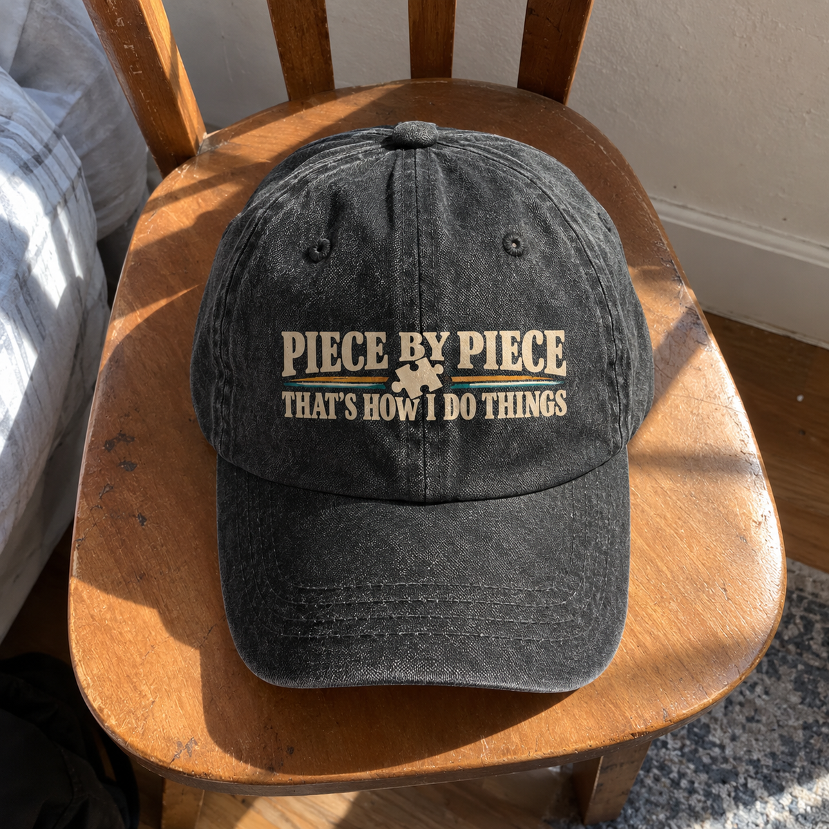 Black vintage washed cap with printed “Piece By Piece. That’s How I Do Things” slogan