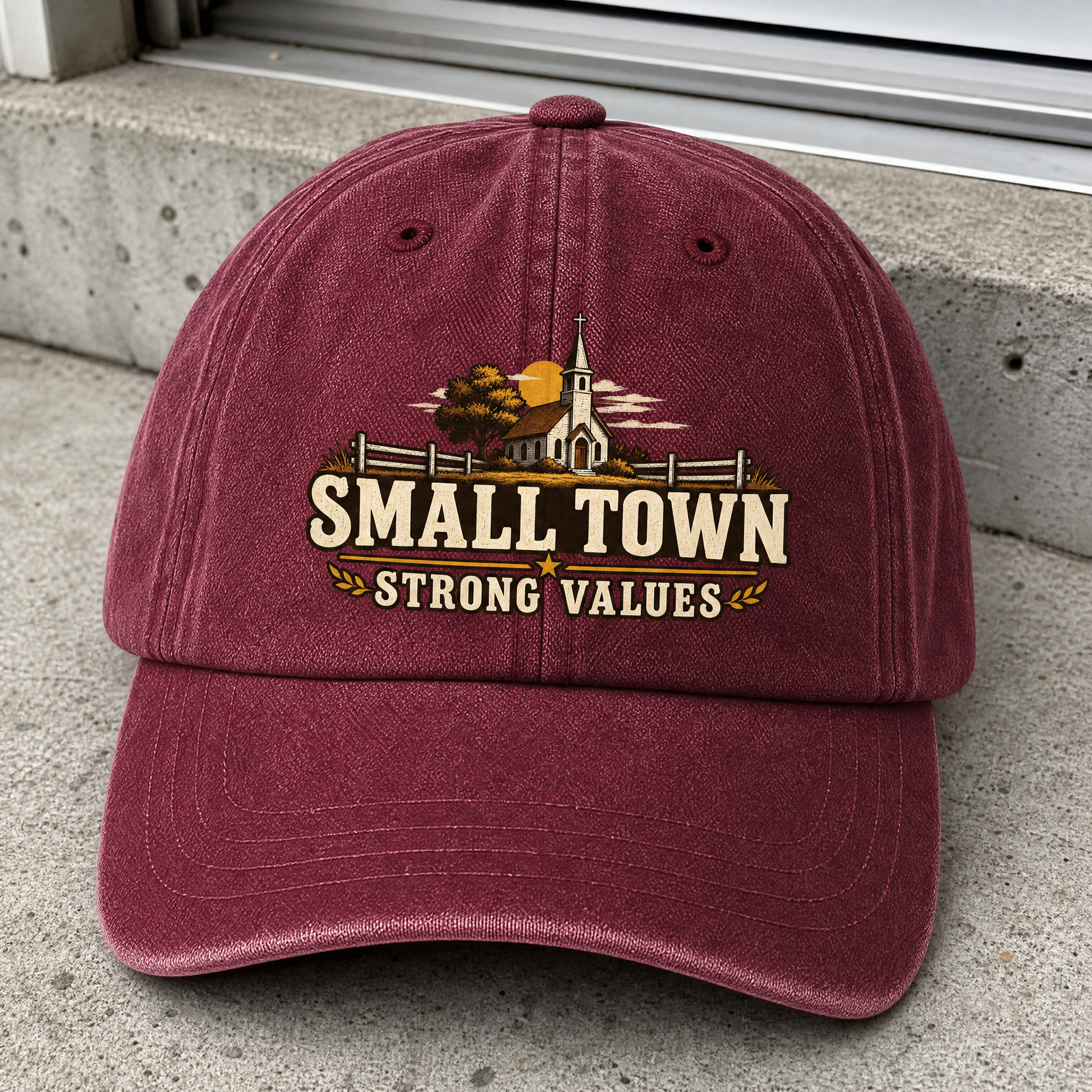 Burgundy vintage washed cap with printed Small Town Strong Values church design, front view