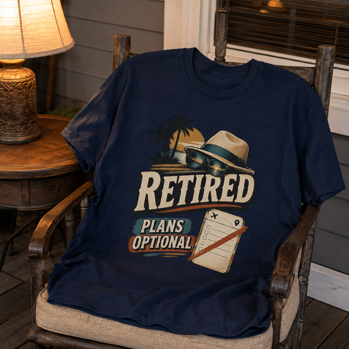 Navy vintage t-shirt with printed Retired Plans Optional design on chair