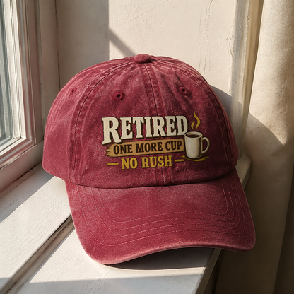 Burgundy vintage washed cap with printed “Retired One More Cup. No Rush” slogan, hero view.