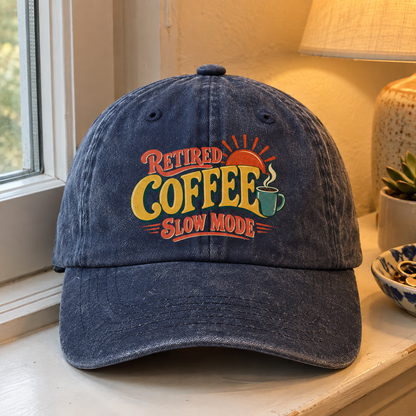 vintage washed cap product shot with Retired Coffee Slow Mode printed design