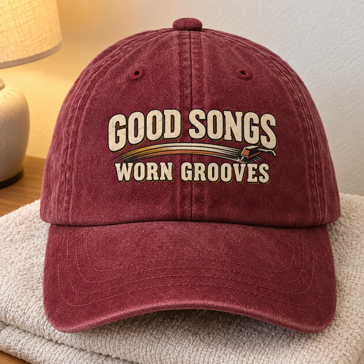 Burgundy vintage washed cap with printed Good Songs Worn Grooves slogan, front hero view