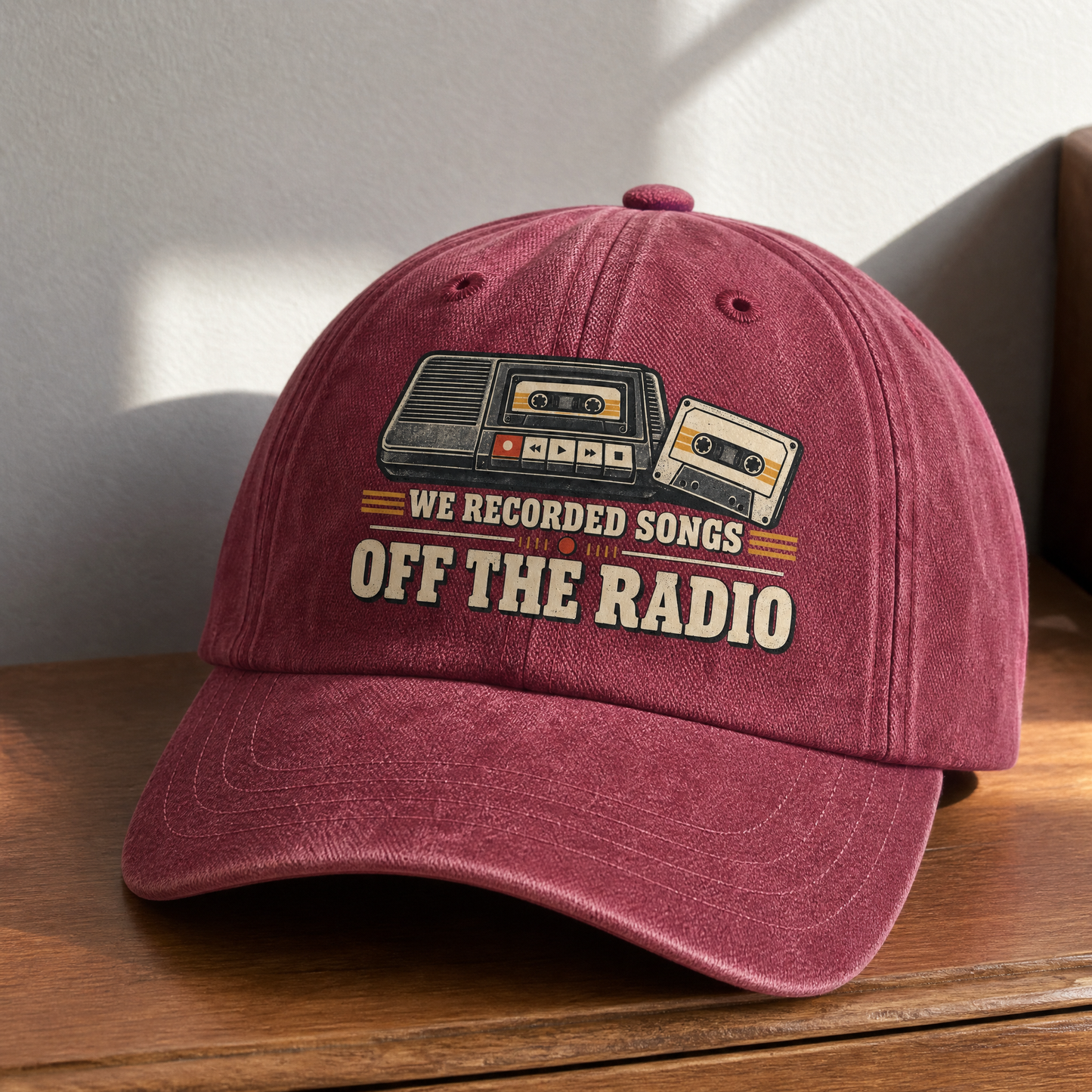 Burgundy vintage washed cap with printed “We Recorded Songs Off The Radio” design, front view