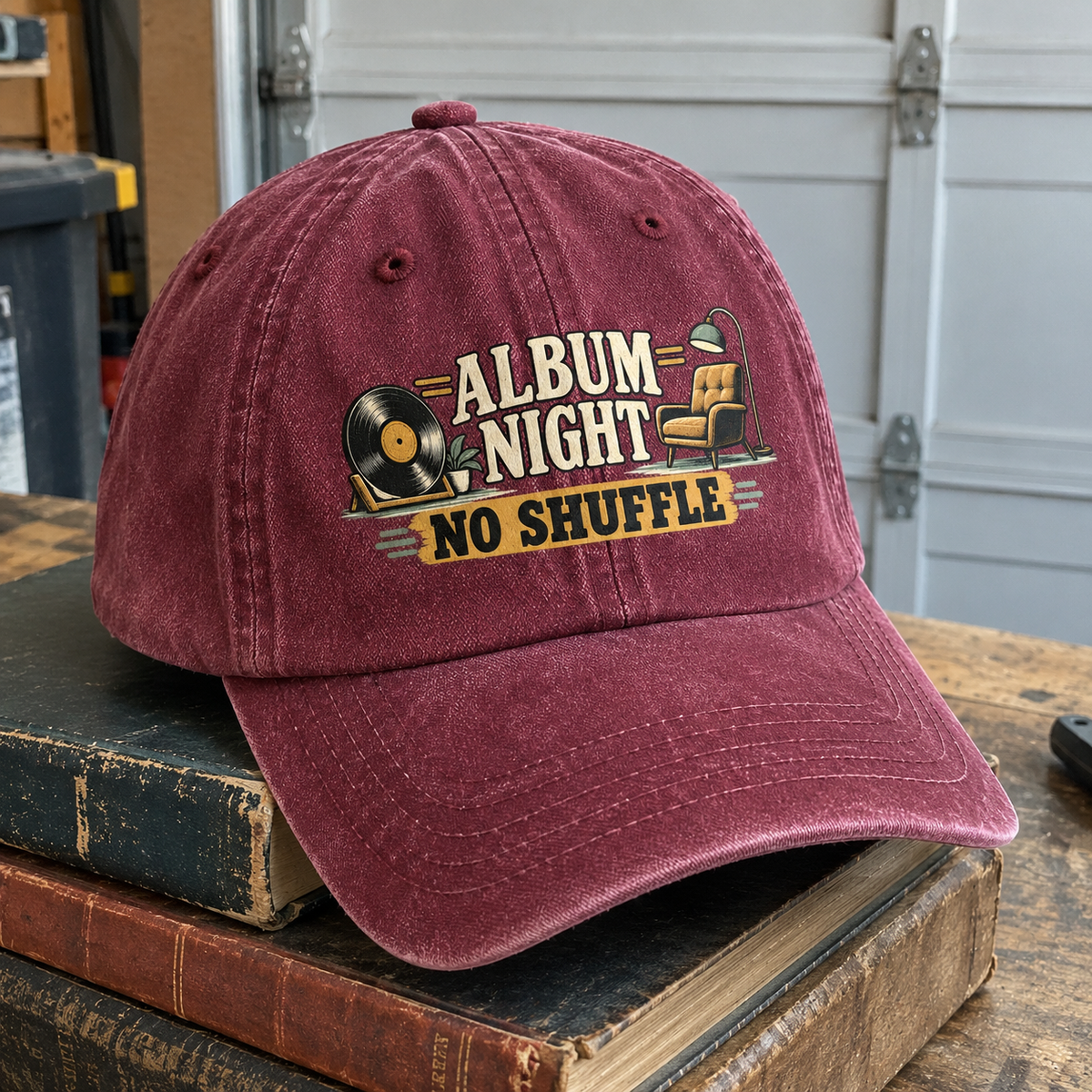 Burgundy vintage washed cap featuring printed Album Night No Shuffle slogan with vinyl record and chair