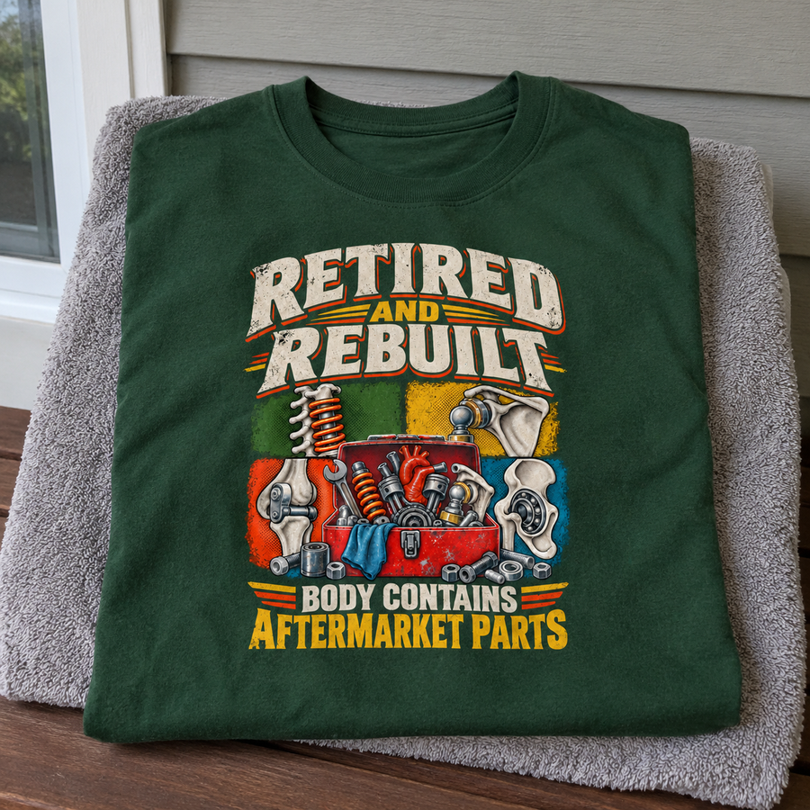 Green vintage T-shirt with printed Retired And Rebuilt slogan, illustrated mechanical parts, and aftermarket parts text