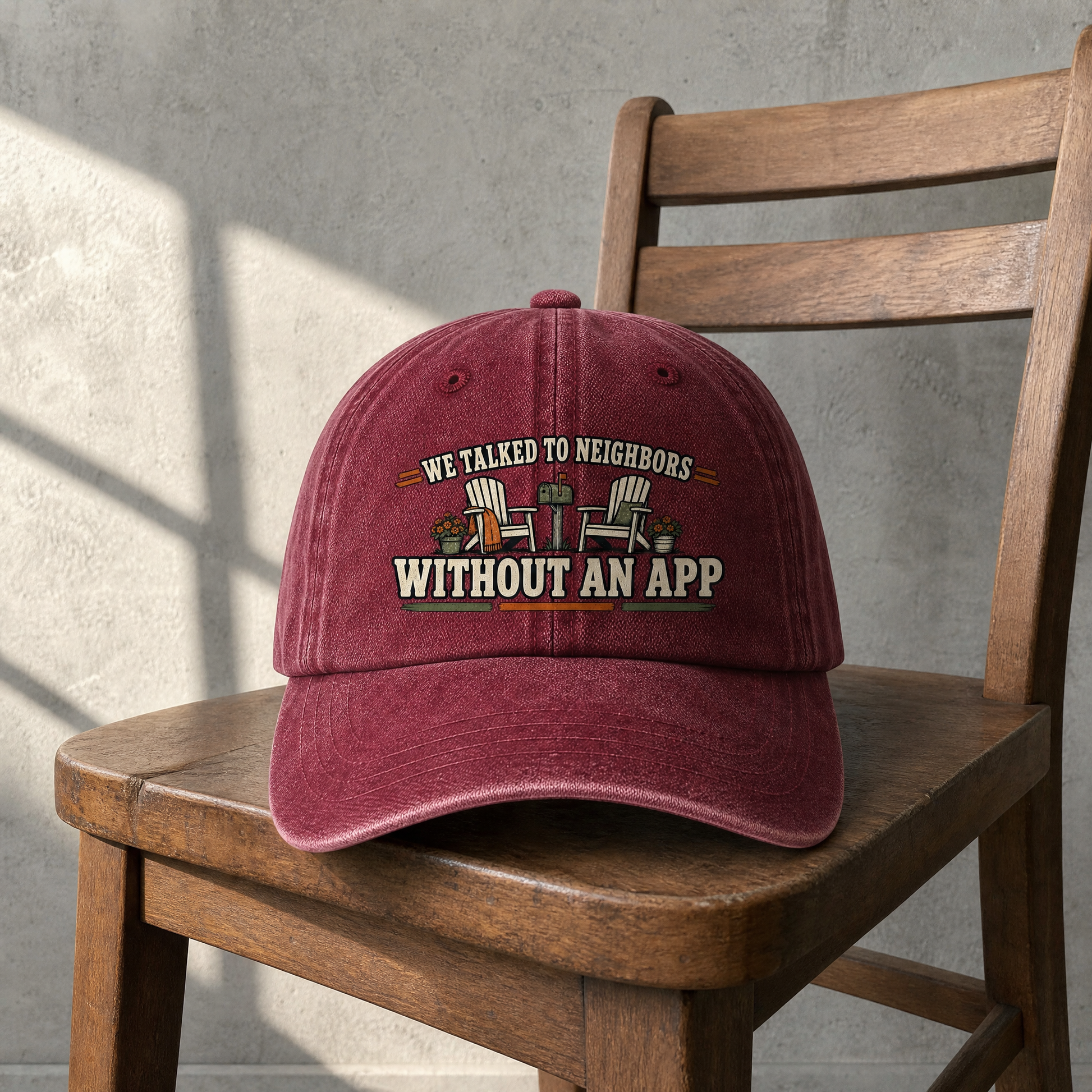 Burgundy vintage washed cap with printed “We Talked To Neighbors Without An App” slogan, front view