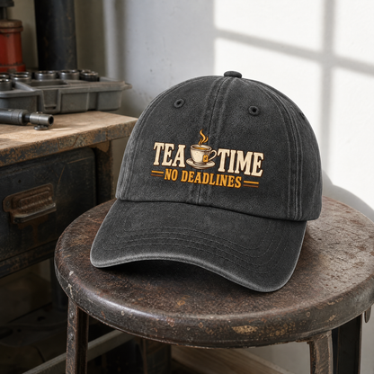 Black vintage washed cap printed with Tea Time. No Deadlines slogan, front hero view.