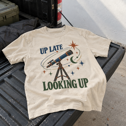 Vintage t-shirt with Up Late Looking Up telescope print on cream fabric, hero view