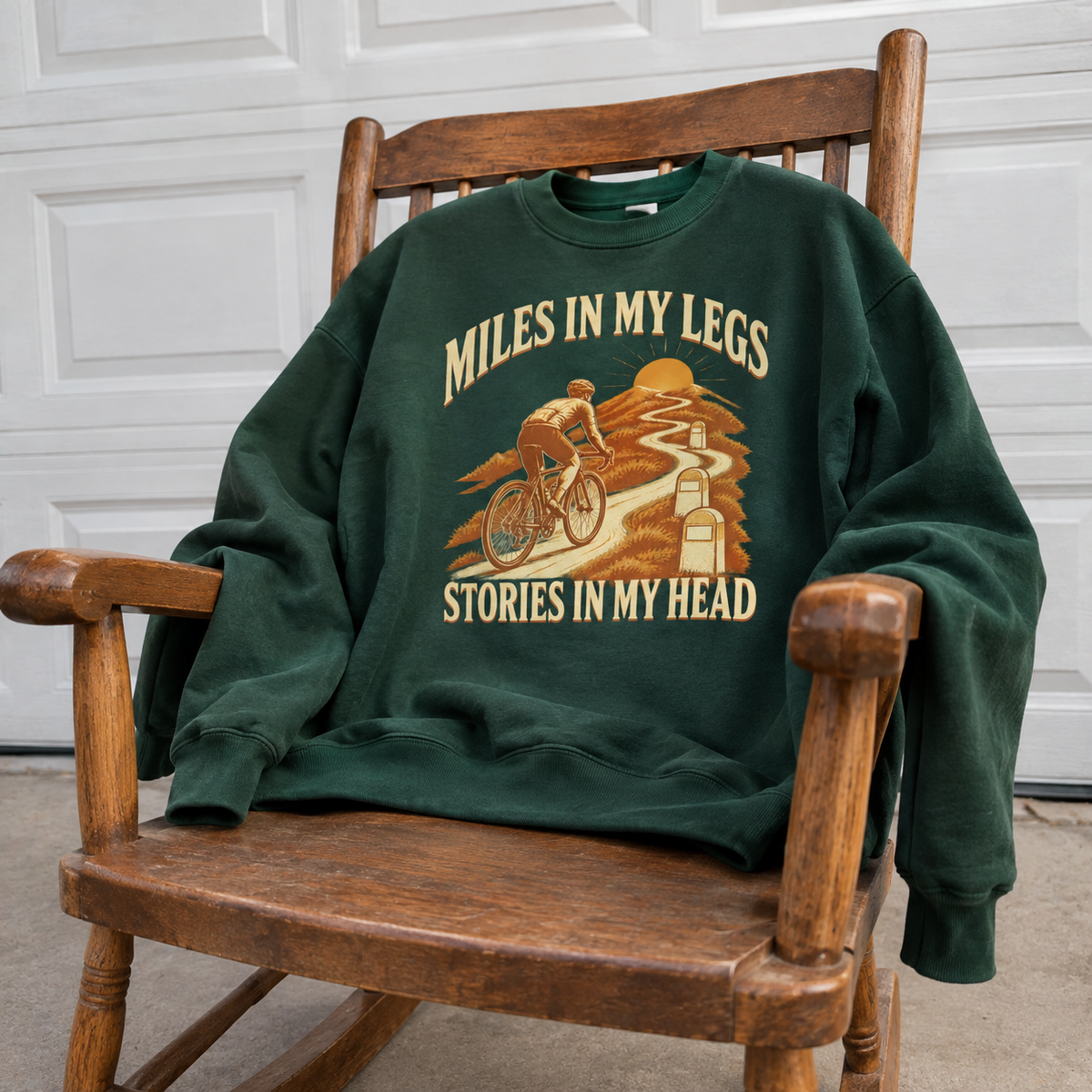 Vintage green sweatshirt with printed cyclist design, Miles In My Legs Stories In My Head slogan