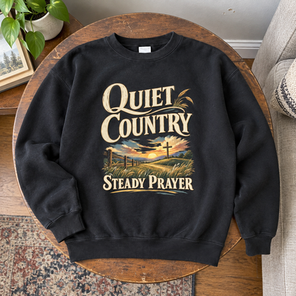 Black vintage sweatshirt with printed Quiet Country Steady Prayer sunset and cross design.