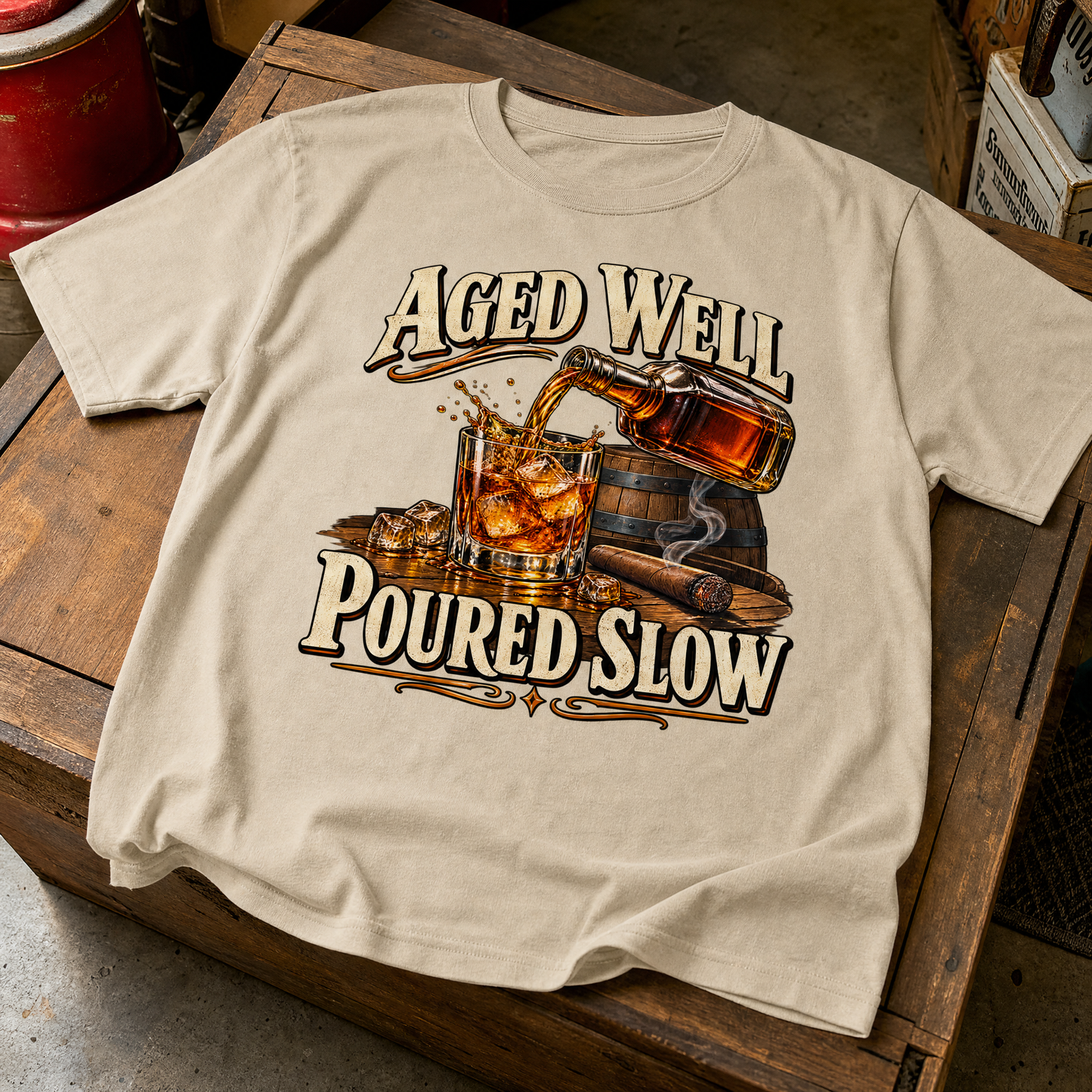 Beige vintage t-shirt with printed Aged Well. Poured Slow whiskey graphic, overhead view