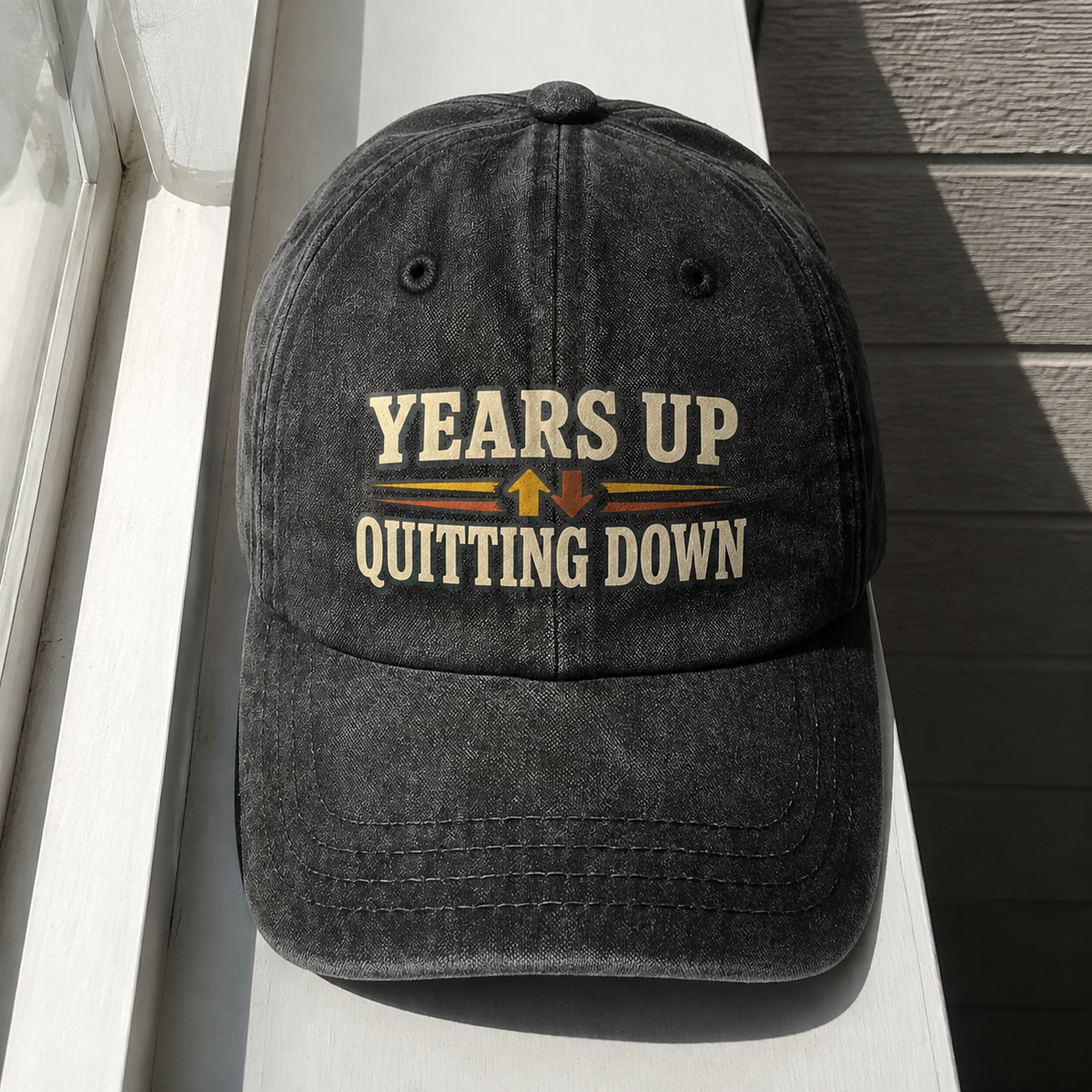 Black vintage washed cap with printed Years Up. Quitting Down slogan, front hero view