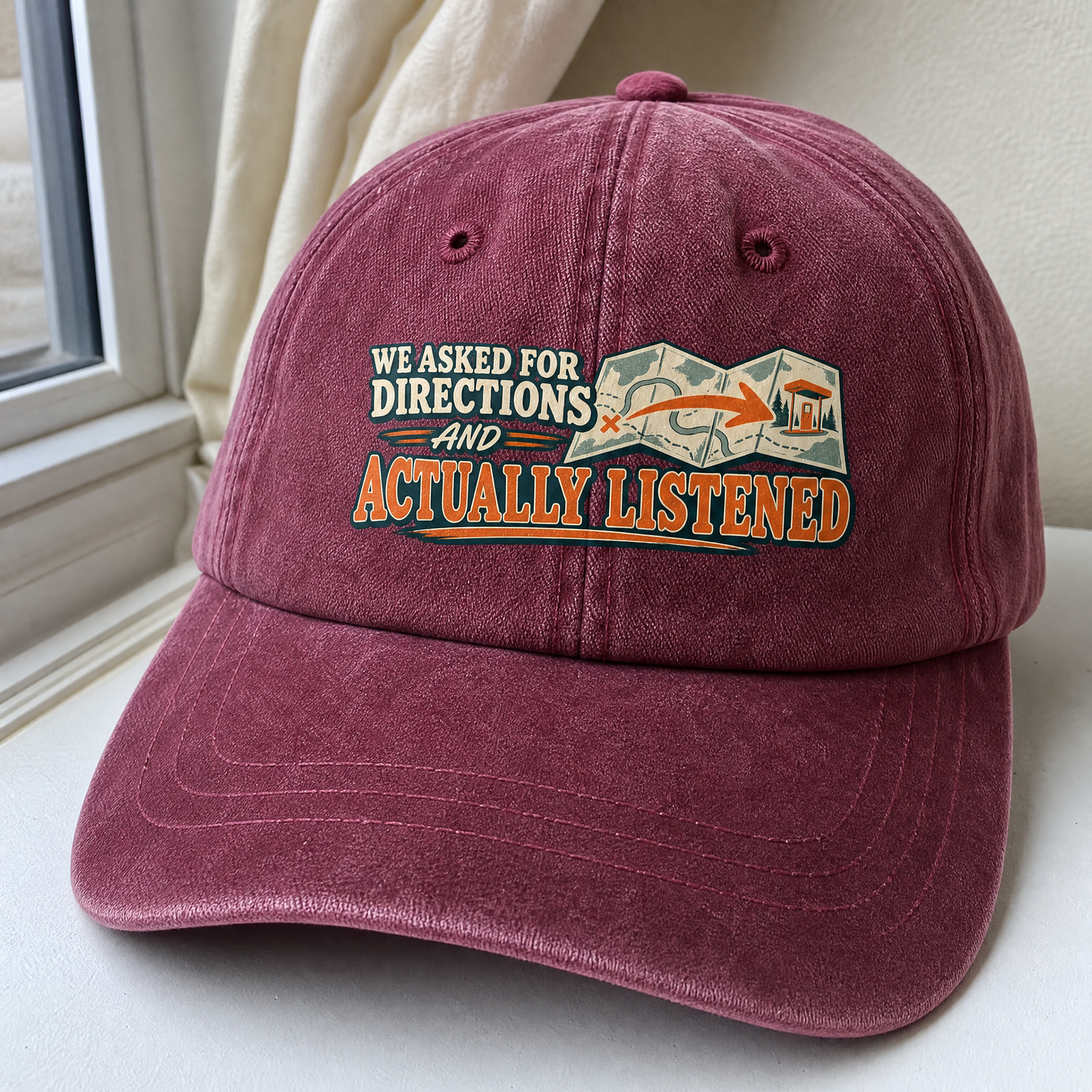 Burgundy vintage washed cap with printed We Asked For Directions And Actually Listened slogan