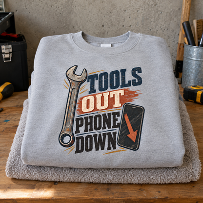 Gray vintage sweatshirt with printed Tools Out Phone Down slogan and wrench design.