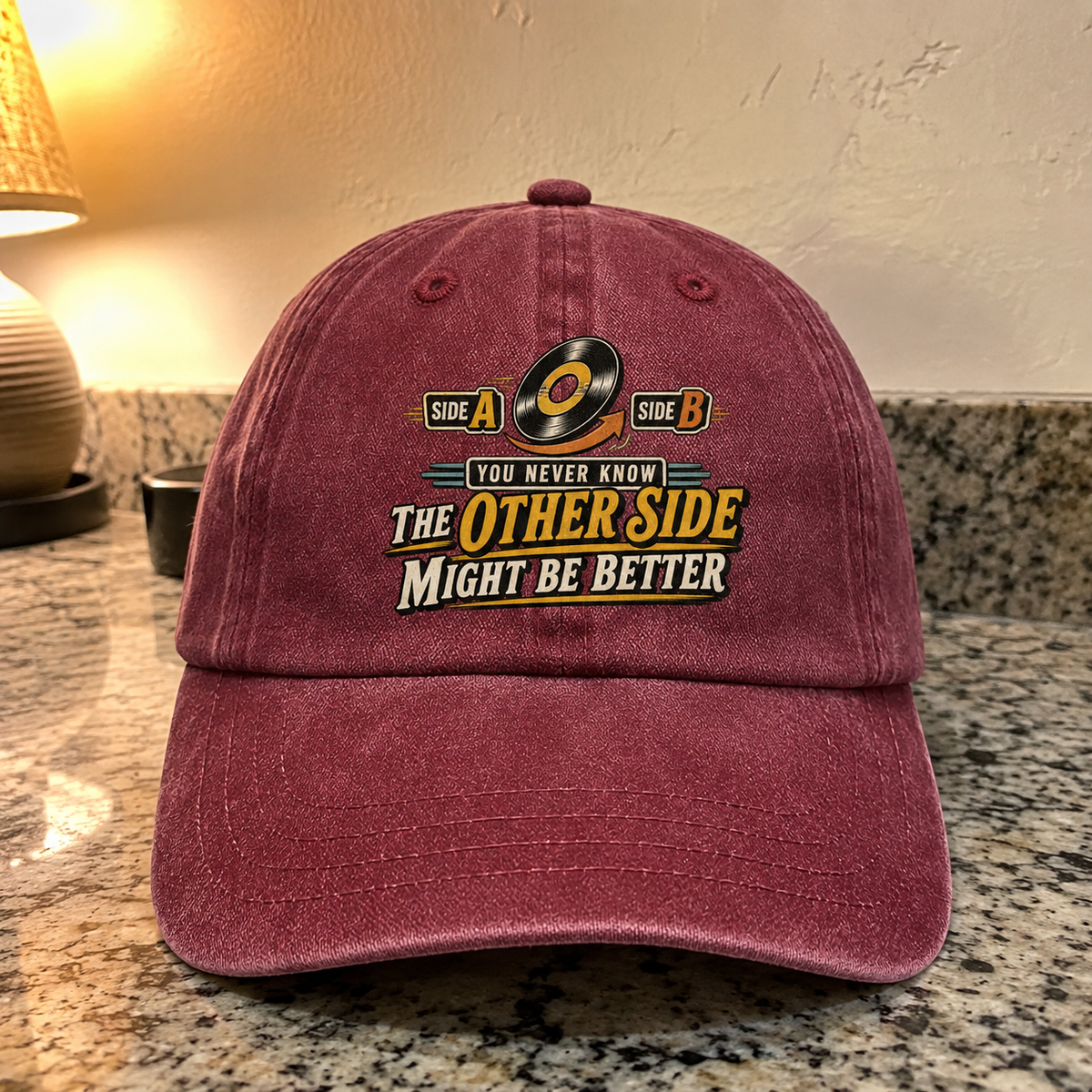 Burgundy vintage washed cap with printed You Never Know slogan and Other Side design