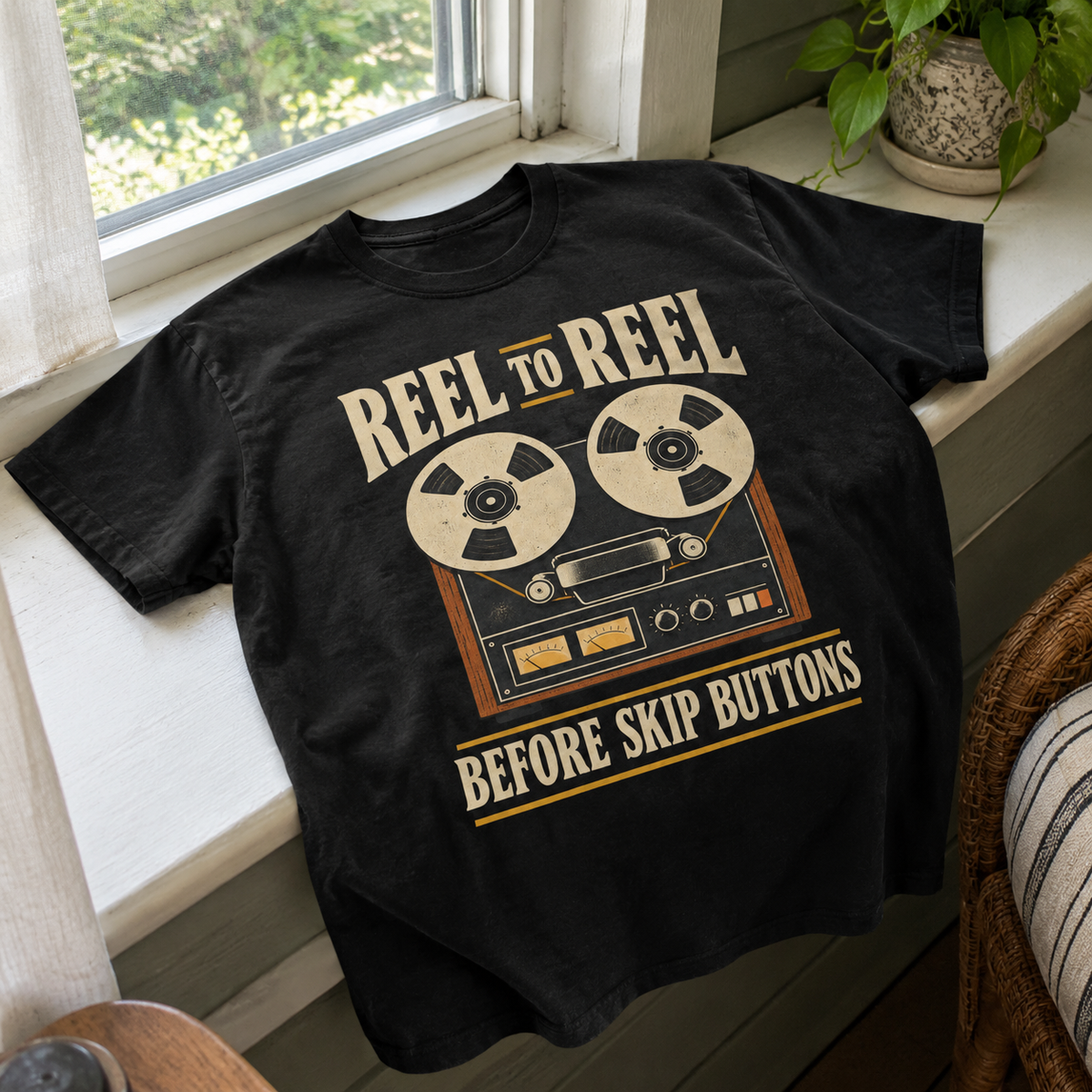 Black vintage t-shirt with printed Reel To Reel Before Skip Buttons design, angled hero view