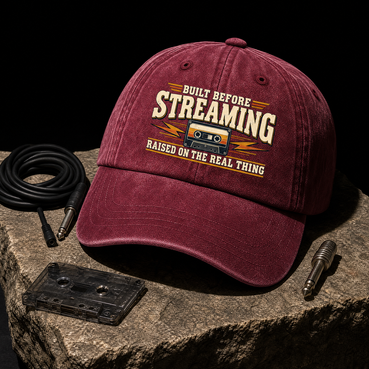 Burgundy vintage washed cap featuring printed Built Before Streaming Raised On The Real Thing slogan
