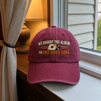 Burgundy vintage washed cap with We Bought The Album For One Good Song printed design