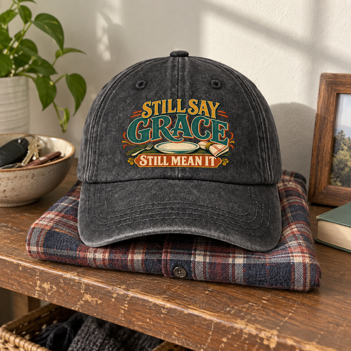 Charcoal vintage washed cap with printed Still Say Grace Still Mean It slogan.