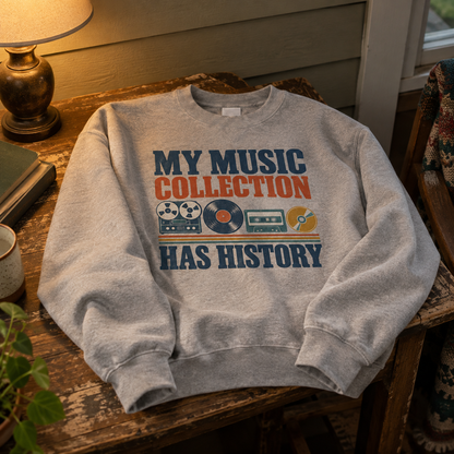 Gray vintage sweatshirt with printed My Music Collection Has History slogan and retro music graphics