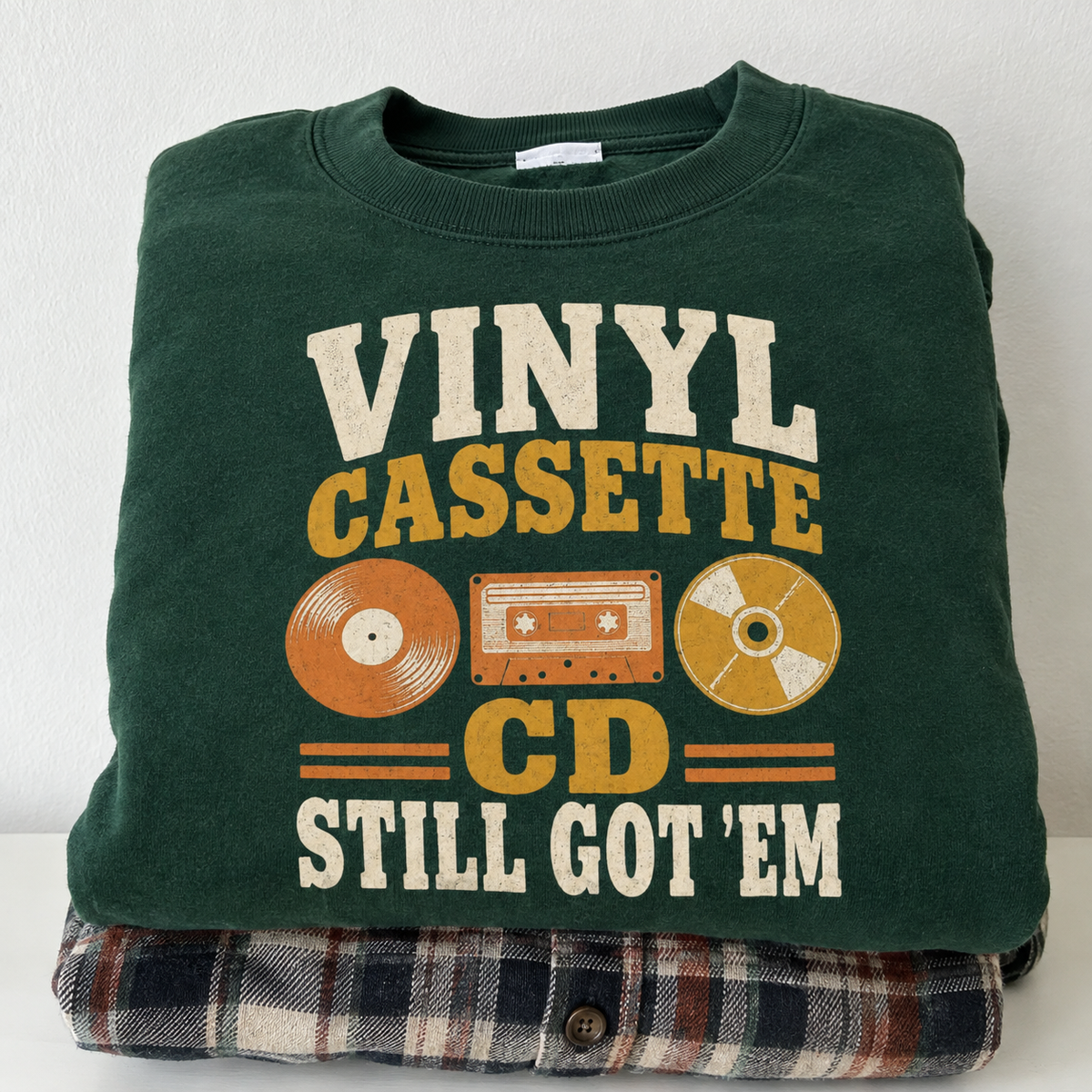 Green vintage sweatshirt with printed Vinyl Cassette CD Still Got’Em design, hero view