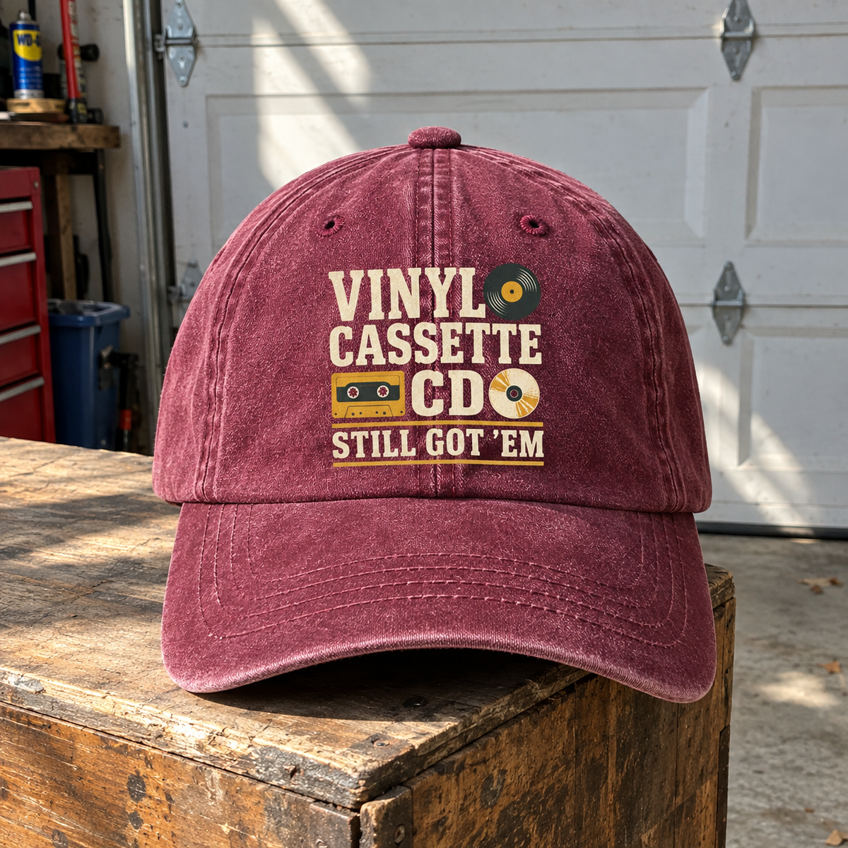 Burgundy vintage washed cap with printed Vinyl Cassette CD Still Got 'Em slogan, hero view